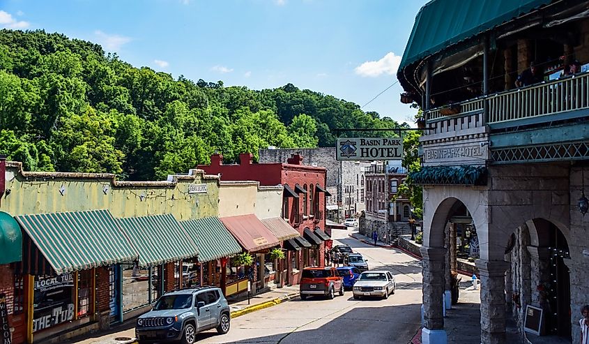 Downtown Eureka Springs, AR, with shopping malls and famous buildings.